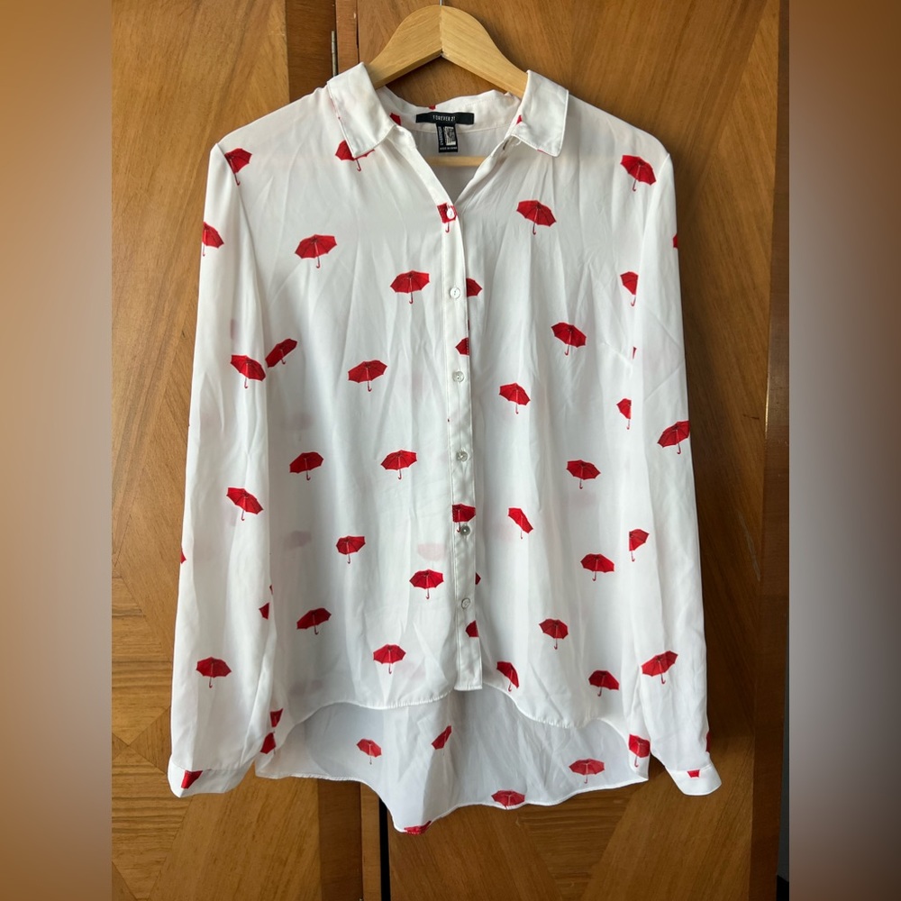 Size large Forever 21 white blouse with red umbrellas all over.